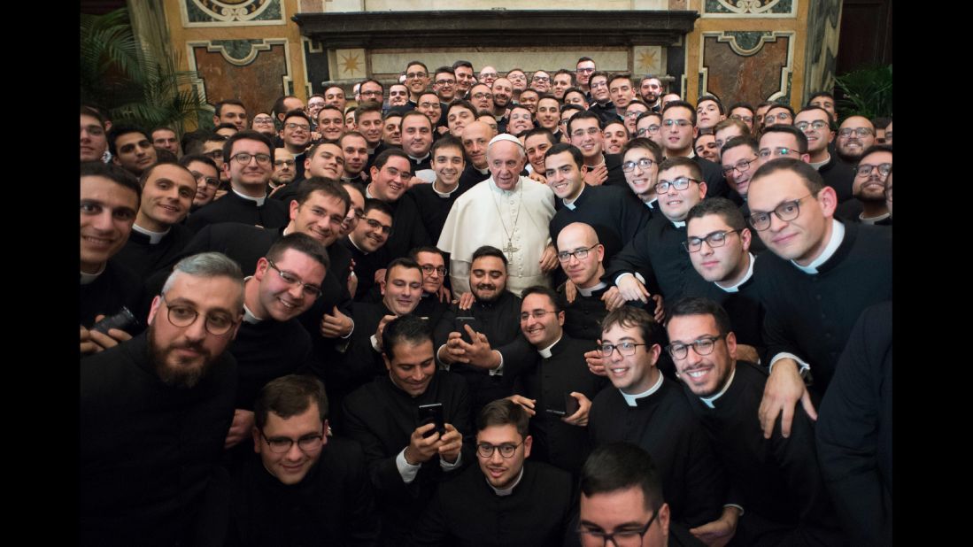 Pope Francis poses with members of the International Catholic Rural Association at the Vatican on Saturday, December 10, 2016.