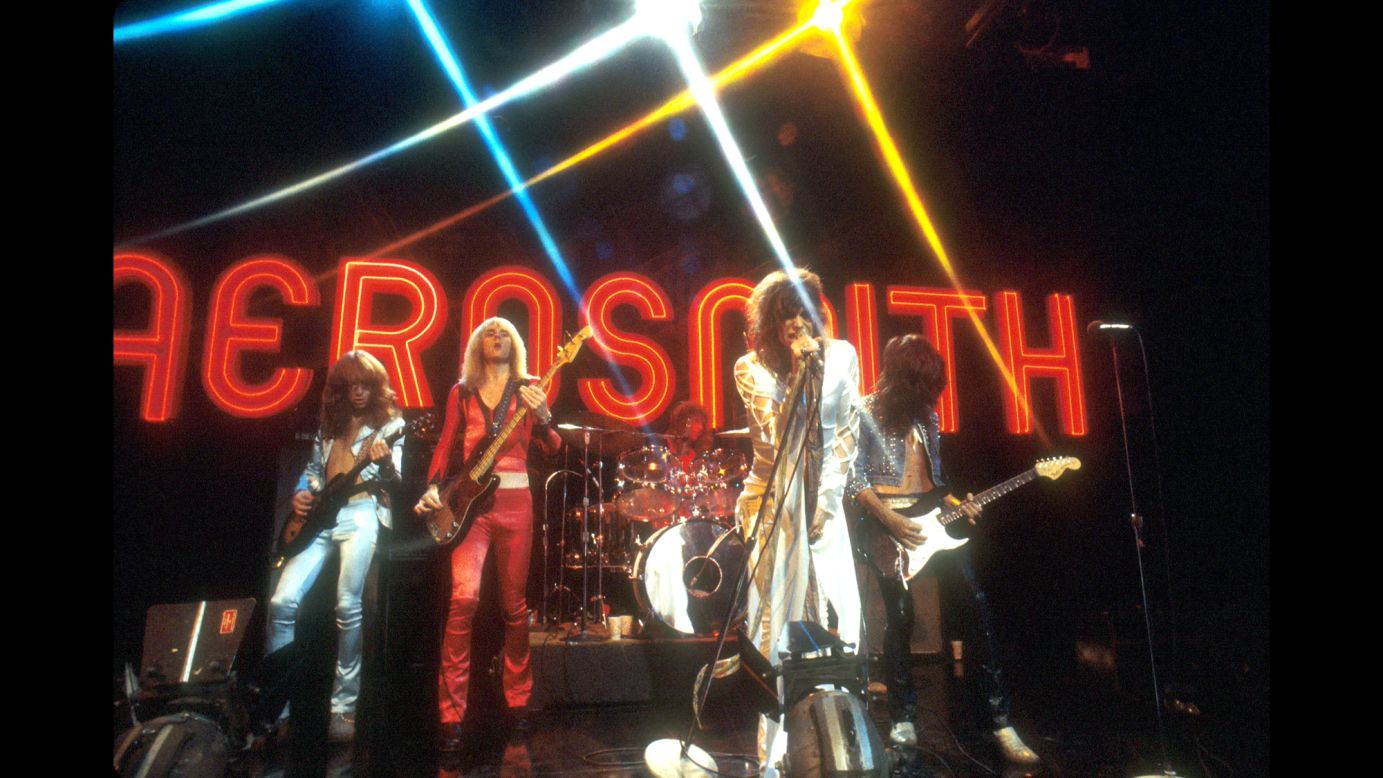 These Rock and Roll Hall of Famers exploded out of Boston in the 1970s with popular album tracks like "Dream On" and "Sweet Emotion." Shown here during a 1974 performance on TV's "Midnight Special," Aerosmith are (left to right) guitarist Brad Whitford, bassist Tom Hamilton, drummer Joey Kramer, singer/songwriter Steven Tyler and lead guitarist/songwriter Joe Perry. In 1986 they collaborated with Run-DMC, creating a groundbreaking rap/rock version of their hit, "Walk This Way." Later Aerosmith scored again with hit albums like "Pump" and "Get a Grip."  The band has sold 66.5 million units in the US, according to the Recording Industry Association of America. 