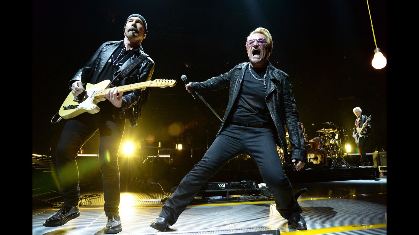 Irish musicians The Edge, left, Bono, center, Larry Mullen on drums and bassist Adam Clayton, right, have been playing together as U2 since 1976. During those 40 years, they've regularly adapted their music to reflect their changing interests. First cracking the US Top 40 with "Pride in the Name of Love" in 1984, they scored their first No. 1 hit three years later with "With or Without You." U2 has sold 52 million units in the US, according to the Recording Industry Association of America.