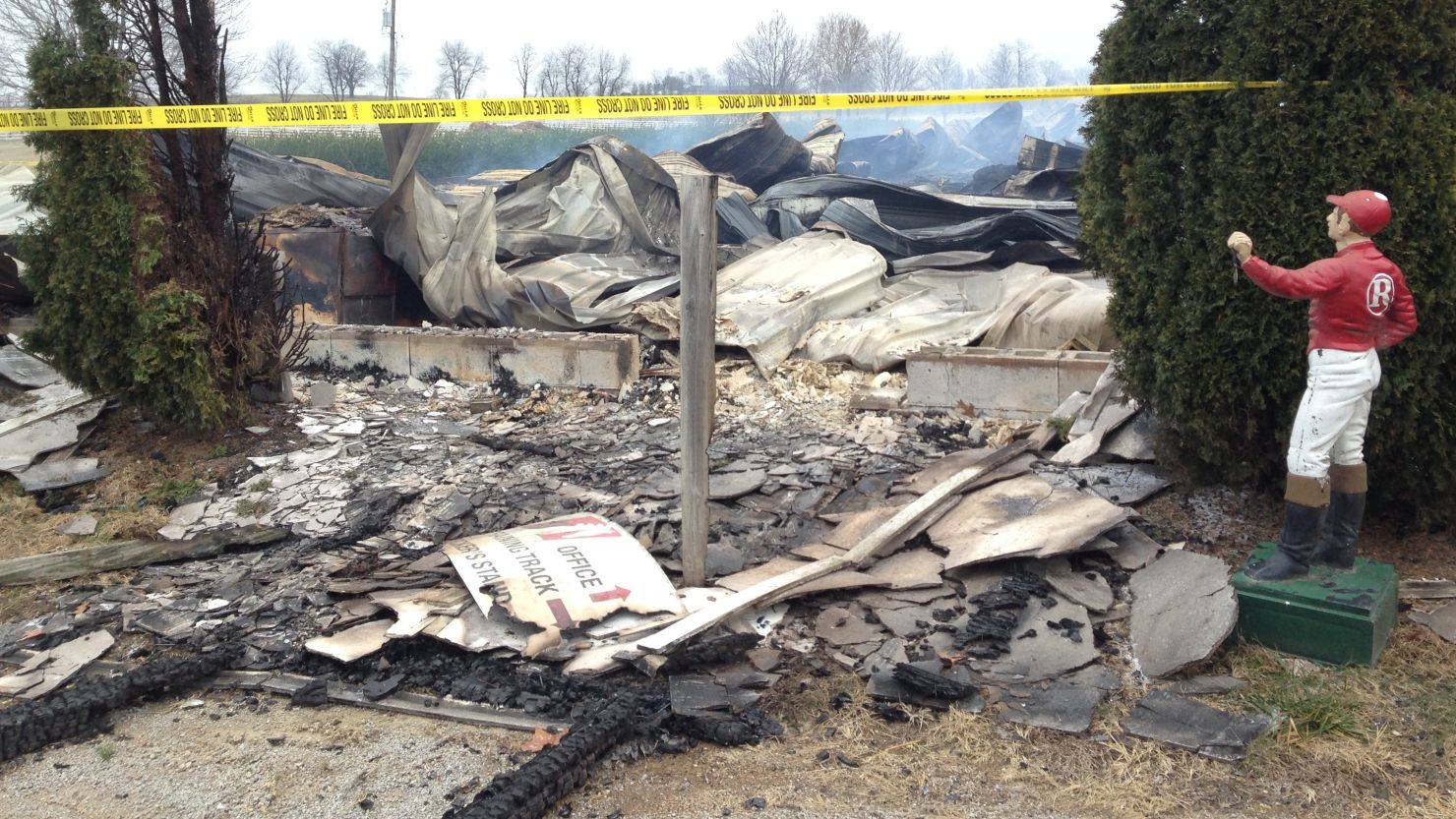 Debris covers the ground after a fire at the Mercury Equine Center outside Lexington, Kentucky. 