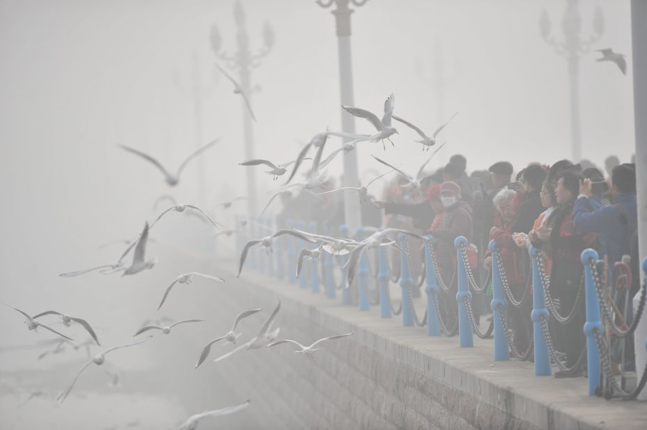 Tourists visit the Zhan Qiao, a wharf in Qingdao, China, on December 19.