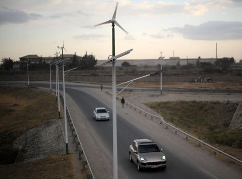 Street lamps powered by wind and solar energy line the side of a road close to the Kenyan capital Nairobi. Kenya is making a priority of wind, notably through the Lake Turkana Wind Power Project that will be the largest in Africa with a capacity of 310 MW. 