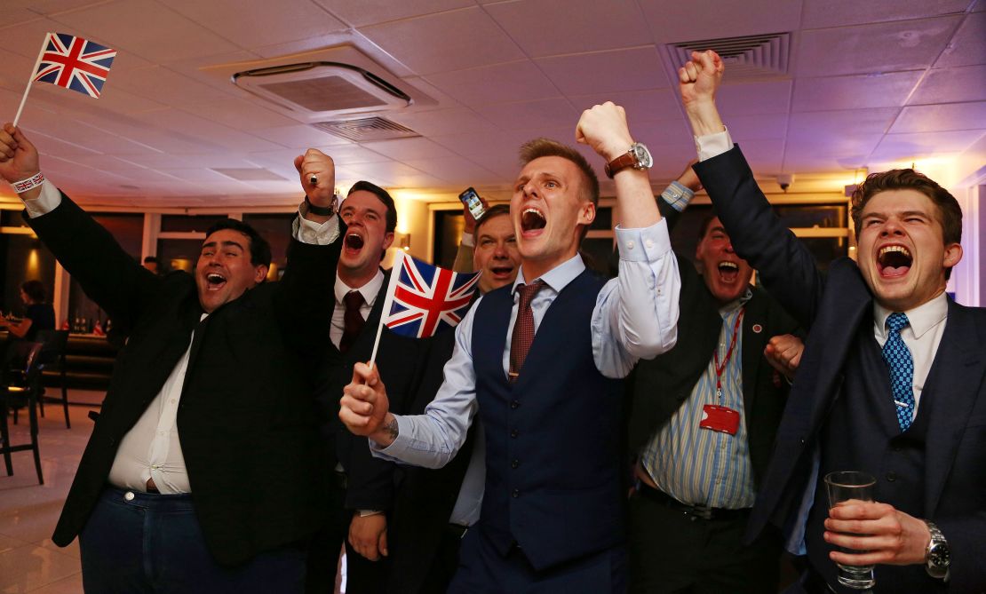 Leave.EU supporters wave Union flags and cheer as the Brexit results come in.