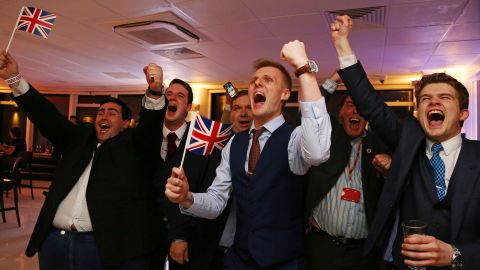 Leave.EU supporters wave Union flags and cheer as the Brexit results come in.