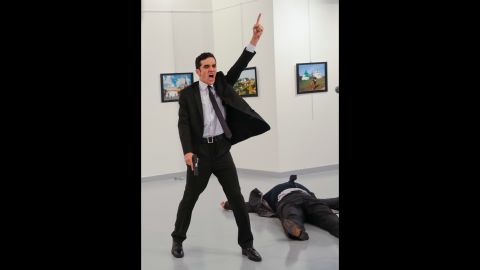 <strong>December 19:</strong> A gunman gestures after <a href="http://www.cnn.com/2016/12/19/middleeast/gallery/andrey-karlov-shooting/index.html" target="_blank">assassinating Andrey Karlov,</a> the Russian ambassador to Turkey, at a photo exhibition in Ankara, Turkey. Turkish Interior Minister Suleyman Soylu said the gunman was Mevlut Mert Altintas, a Turkish police officer. In a video circulating on social media, the shooter was heard shouting, "Allahu akbar (God is greatest). Do not forget Aleppo! Do not forget Syria! Do not forget Aleppo! Do not forget Syria!" Russia is the most powerful ally of the Syrian regime and has carried out airstrikes since September 2015 to prop up embattled leader Bashar al-Assad. Karlov, 62, <a href="http://www.cnn.com/2016/12/19/europe/who-was-andrey-karlov/" target="_blank">had served in Ankara </a>since July 2013.