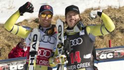 Patches of snow on the dry hill are seen behind Norwegians Aksel Lund Svindal (L), second, and Kjetil Jansrud, third, as they celebrate after the FIS Alpine World Cup Men's Downhill on November 30, 2012 in Beaver Creek, Colorado.     AFP PHOTO / DON EMMERT        (Photo credit should read DON EMMERT/AFP/Getty Images)