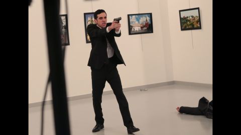 The man holds his gun up after shooting Karlov. The attack occurred at the Cagdas Sanat Merkezi modern arts center in Ankara. Turkish Interior Minister Suleyman Soylu said in a news conference that the gunman was Mevlut Mert Altintas, a Turkish police officer.