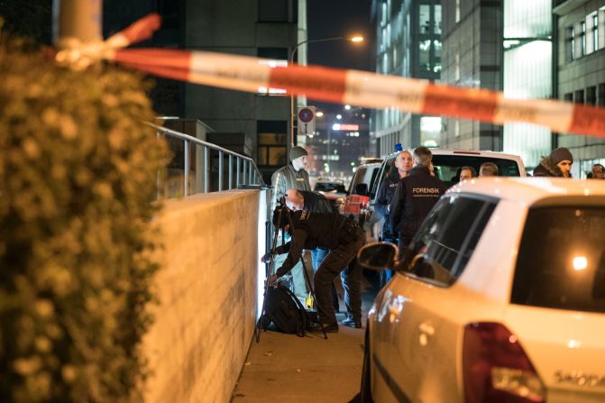 Police officers secure the area near an Islamic center in Zurich, Switzerland, after three people were shot there on Monday, December 19. A gunman, decked out in dark clothing, opened fire on a group of worshipers standing inside a prayer room, police said, citing eyewitnesses.