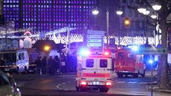 An ambulance and rescue workers arrive to the area after a lorry truck ploughed through a Christmas market on December 19, 2016 in Berlin, Germany. Several people have died while dozens have been injured as police investigate the attack at a market outside the Kaiser Wilhelm Memorial Church on the Kurfuerstendamm and whether it is linked to a terrorist plot.