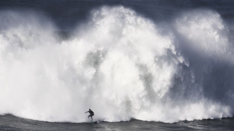 Alex Botelho surfs during a big-wave session in Nazare, Portugal, on Saturday, December 17.