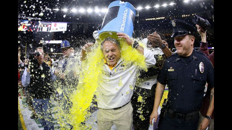 Southern Miss head coach Jay Hopson is doused after his team won the New Orleans Bowl on Saturday, December 17. <a href="index.php?page=&url=http%3A%2F%2Fwww.cnn.com%2F2016%2F12%2F12%2Fsport%2Fgallery%2Fwhat-a-shot-sports-1213%2Findex.html" target="_blank">See 36 amazing sports photos from last week</a>