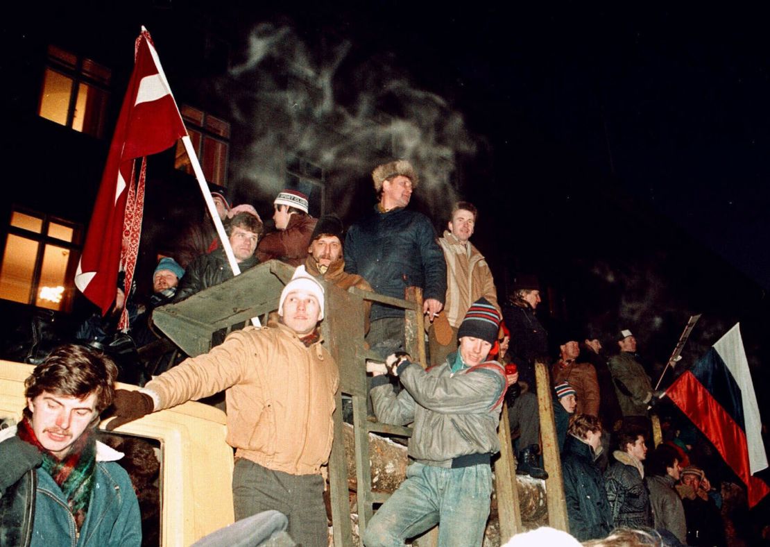 Civilians gather outside a government building barricaded against potential attack by Soviet troops in Riga, Latvia, on January 21, 1991.