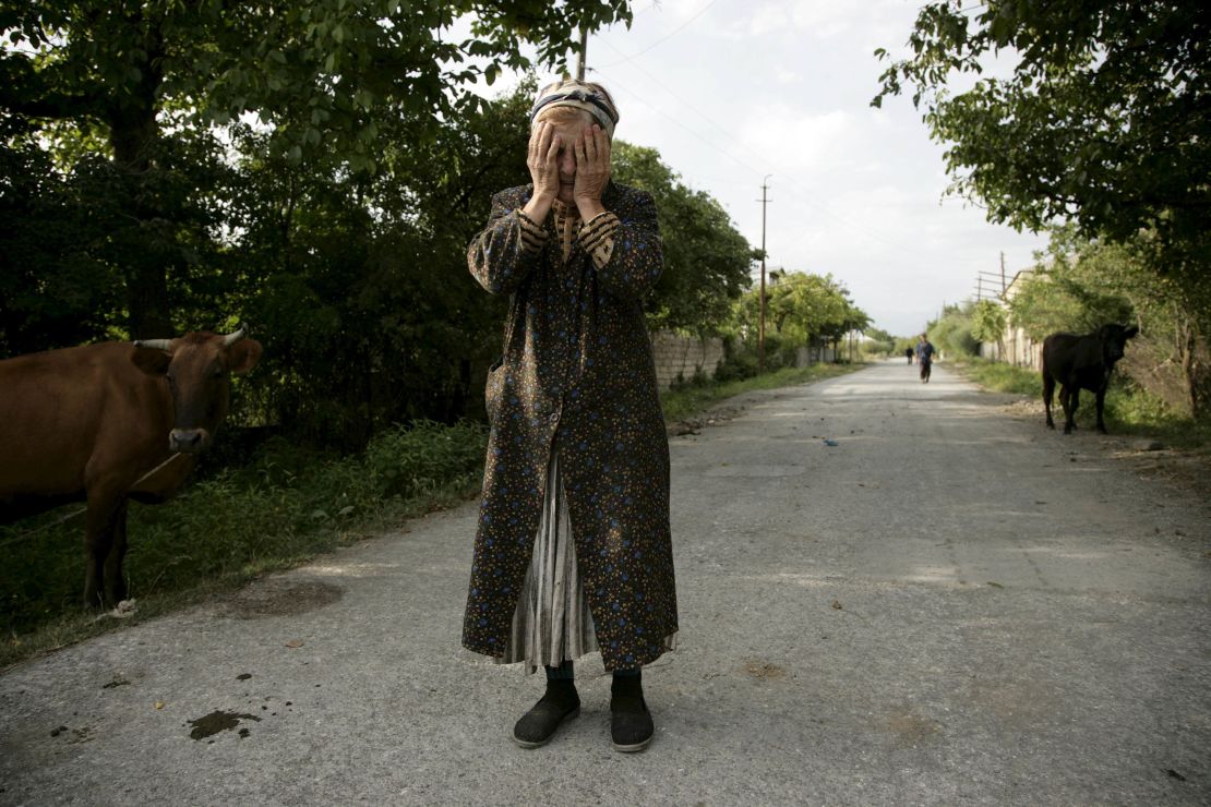 A woman reacts after separatist militia destroyed much of the village of Tkviavi, Georgia, on August 7, 2008. The Ossetian separatist movement sparked Russian intervention in neighboring Georgia, escalating the affair into a military conflict.