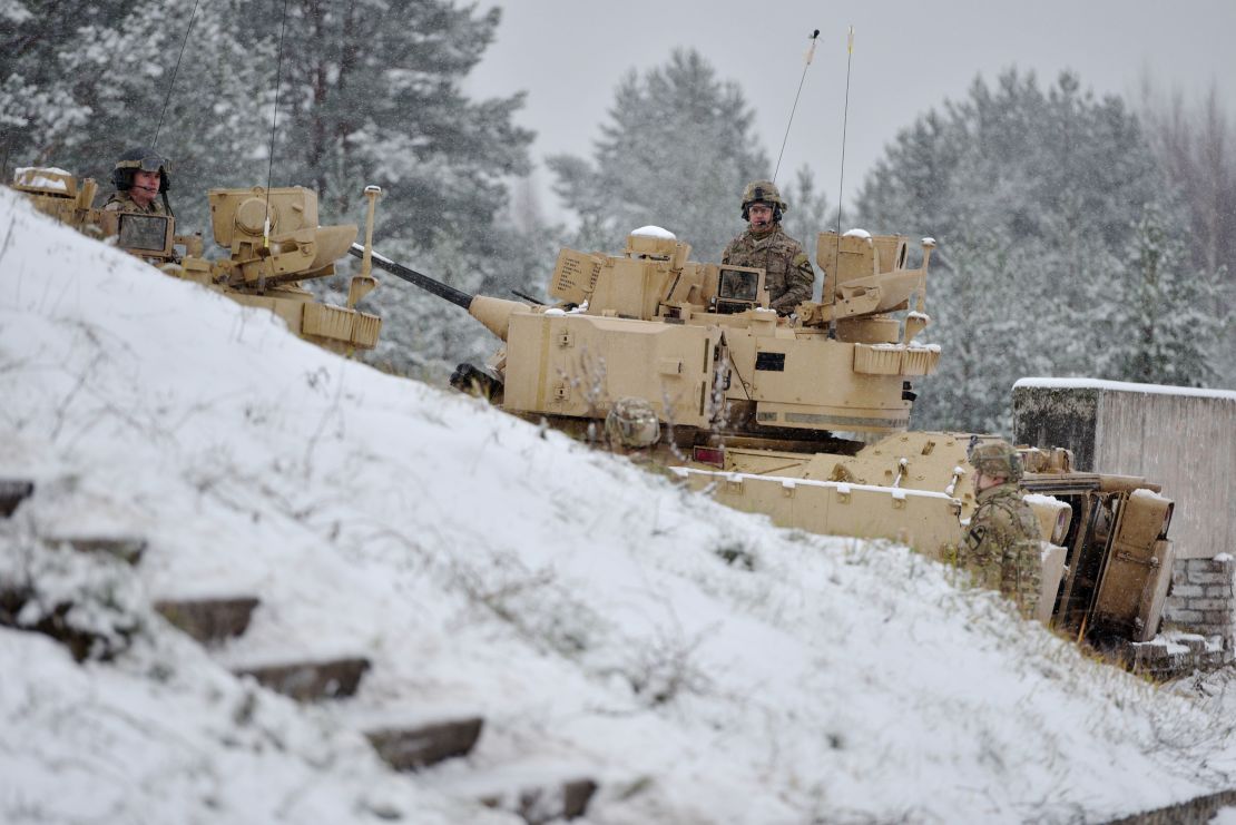 Latvian soldiers take part in live-fire exercises at the Adazi military base outside Riga, Latvia, on December 9, 2014.