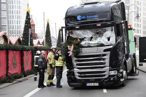 Authorities examine a truck Tuesday, December 20, that crashed into a crowded Christmas market in Berlin the night before. At least 12 people were killed and 48 injured in what police are investigating as a likely terrorist attack.