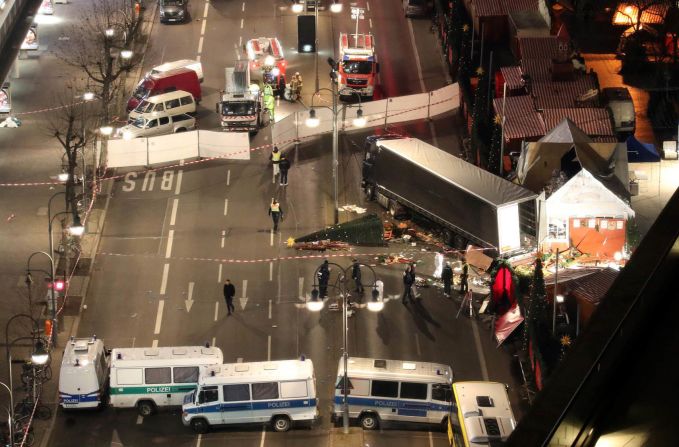 Authorities investigate the crash site on December 20.
