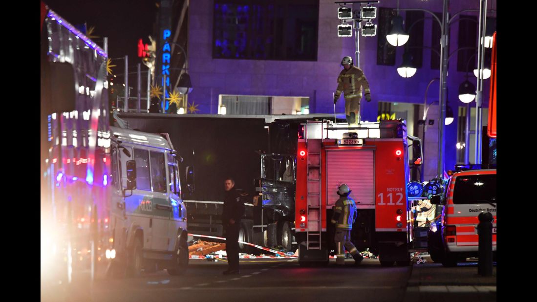 Emergency crews work near the crash site on December 19.