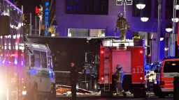 Witnesses describe moment a truck plowed through a Berlin Christmas market, killing 12 people. 