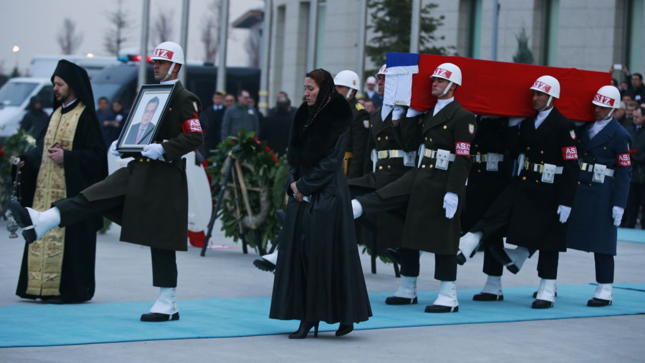 Members of a Turkish forces honor guard carry the Russian flag-draped coffin of Russian Ambassador to Turkey Andrey Karlov.