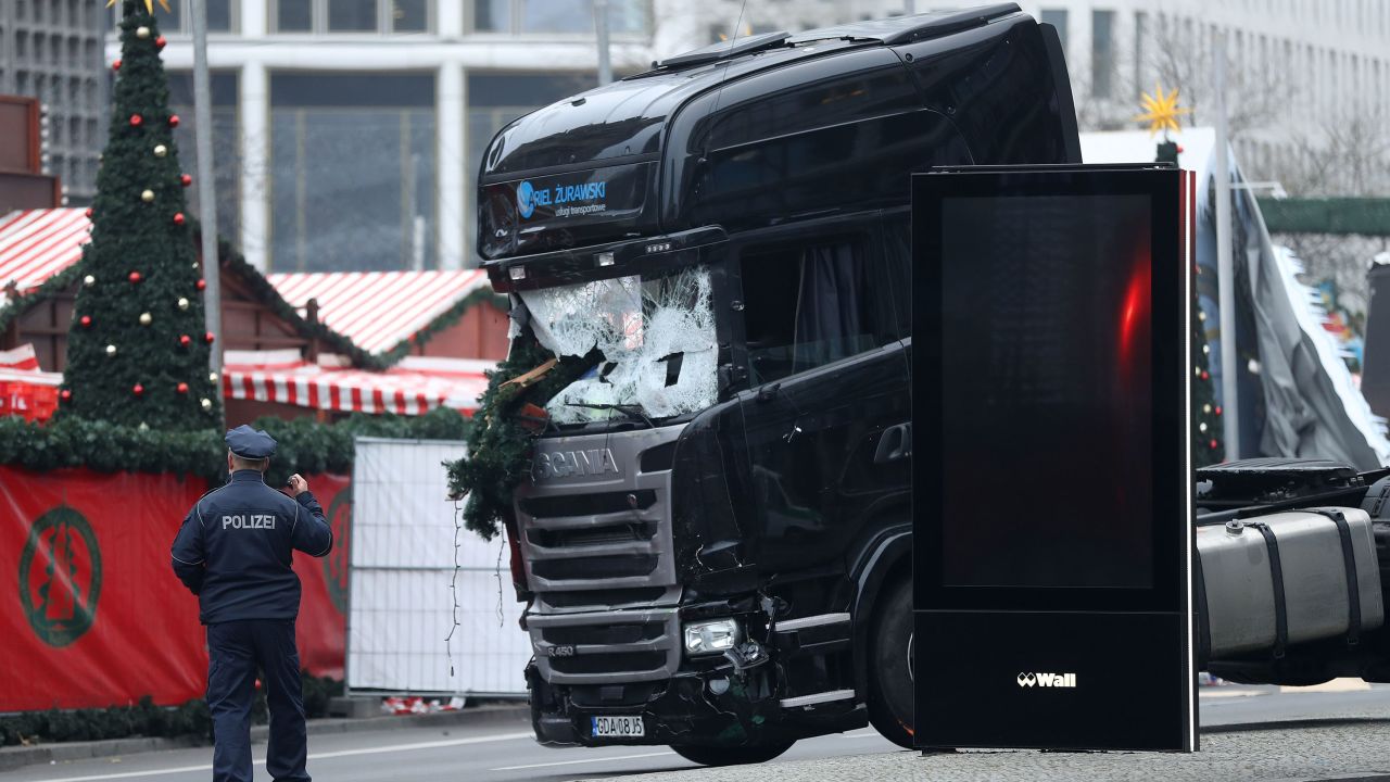 BERLIN, GERMANY - DECEMBER 20:  Rescue workers begin to remove the cab of the lorry the morning after it ploughed through a Christmas market on December 20, 2016 in Berlin, Germany. Several people have died while dozens have been injured as police investigate the attack at a market outside the Kaiser Wilhelm Memorial Church on the Kurfuerstendamm and whether it is linked to a terrorist plot.  (Photo by Sean Gallup/Getty Images)
