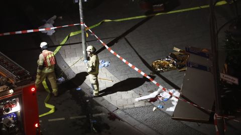 Authorites inspect a truck that sped into a Christmas market in Berlin.