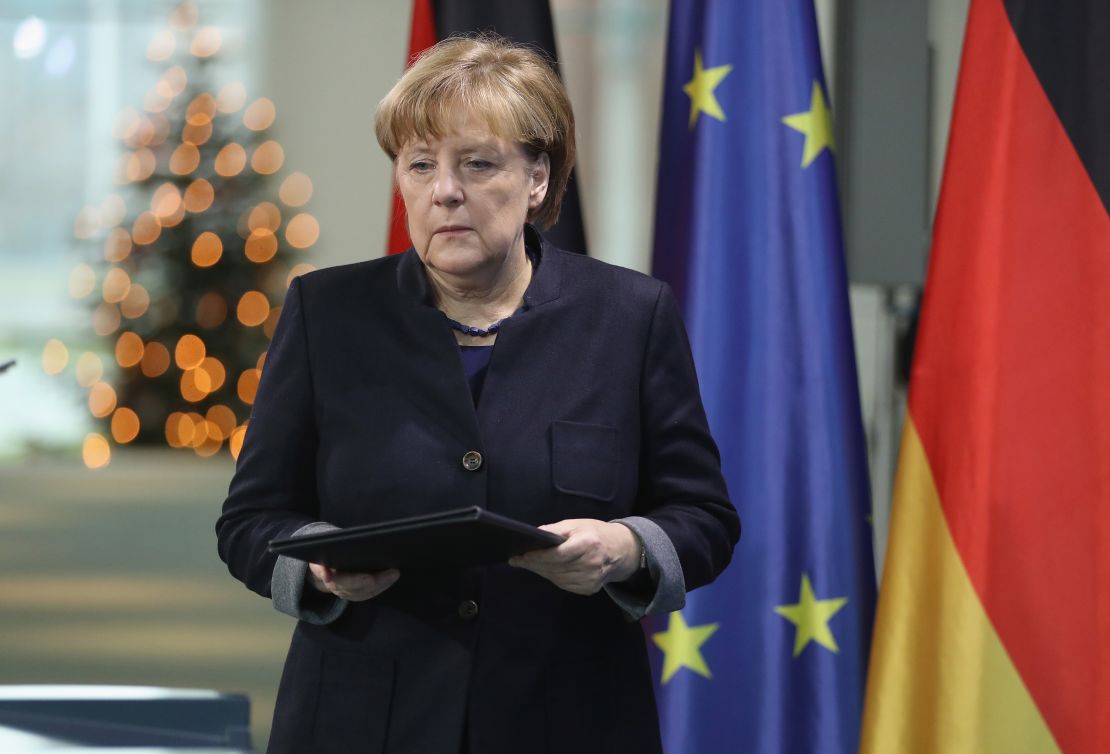 German Chancellor Angela Merkel arrives to give a statement the day after the Berlin attack.