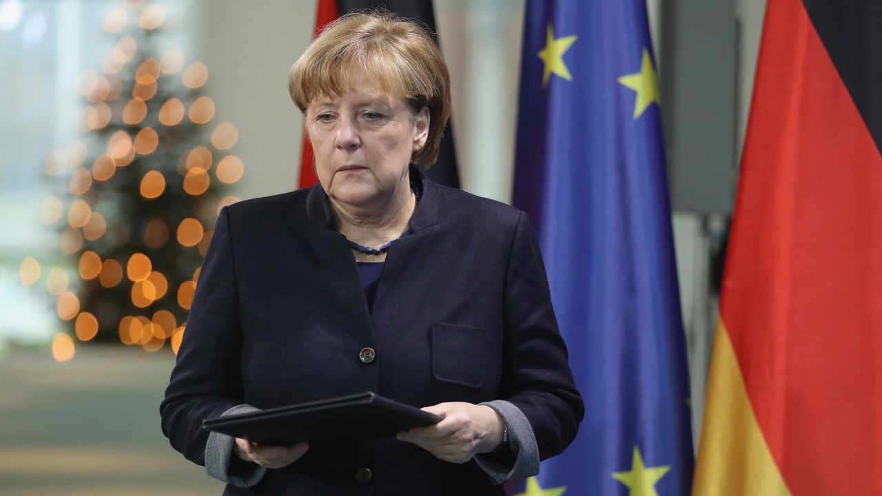 German Chancellor Angela Merkel arrives to give a statement the day after the Berlin attack.