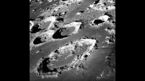 Moon craters are seen in this photo taken from the Apollo 8 spacecraft. When asked to describe the far side of the moon, which no human had seen to that point, Lovell said, "It's like a sand pile my kids have been playing in for a long time. It's all beat up with no definition. Just a lot of bumps and holes."