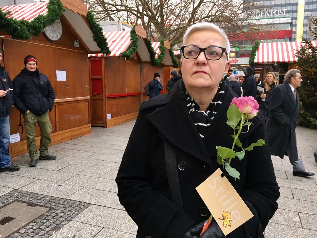 "I'm so sad," said Evita Baumberger, who came to lay a flower at the church.