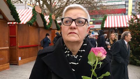 "I'm so sad," said Evita Baumberger, who came to lay a flower at the church.