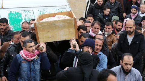 Jordanian mourners carry the coffin of Ibrahim Bashbsha, a day after he died in the attack.