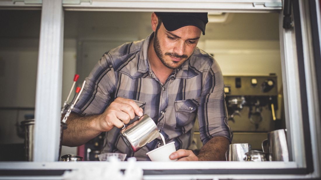 Syrian refugee Ahmad Alzoukani, who has lived in the United States for about a year, works at Refuge Coffee in Clarkston, Georgia.