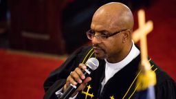 The pastor of Emanuel African Methodist Episcopal (AME) Church, Reverend Eric S. C. Manning, asks members of the congregation to come, kneel and pray with him during Sunday service on Dec. 18. 2016.