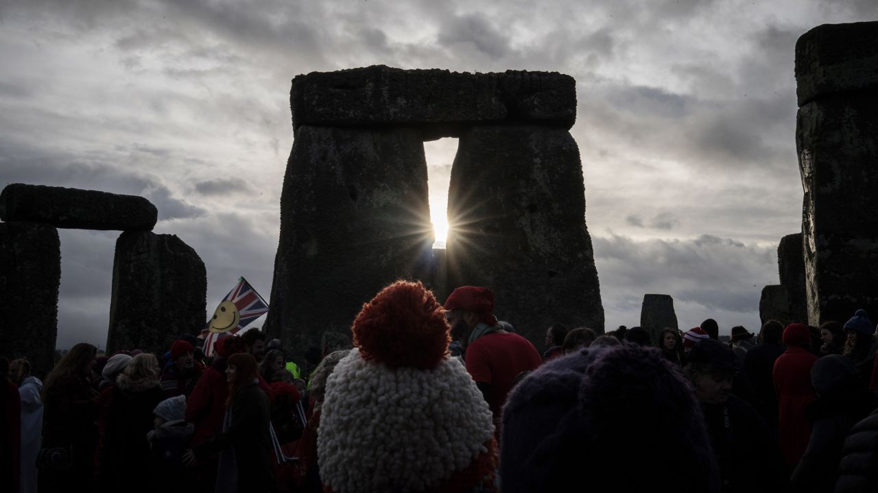 Thousands gather to watch the sun rise over Stonehenge on the Winter and Summer solstices. 