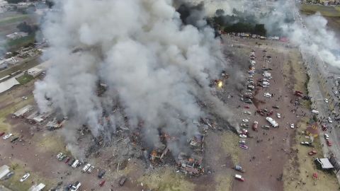 An image captured by a drone shows smoke billowing from the market after a series of blasts Tuesday.