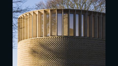"The project encapsulates two architectural images," explains McLaughlin. "The first is a gentle hollow in the ground as a meeting place for the community. The second is a delicate ship-like timber structure that rises into the treetops to gather the light from the leaves."