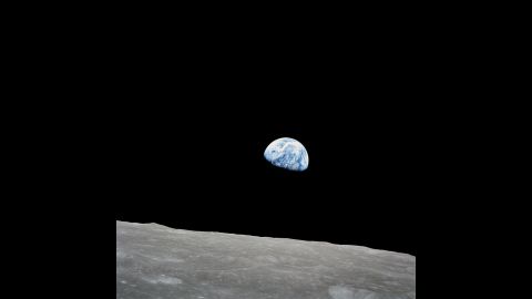 Apollo 8 spent 20 hours orbiting the moon. Anders took this photo of Earth as it appeared to rise from the moon's surface on December 24. The photo, now nicknamed "Earthrise," became one of NASA's most iconic photos. "Oh my God! Look at that picture over there! There's the Earth coming up. Wow, is that pretty," Anders said in a NASA recording before asking Lovell to hand him a roll of color film.