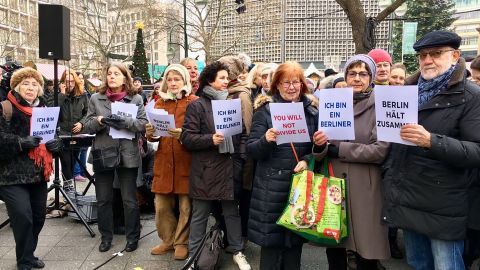 People gather Wednesday in Berlin to sing and pay tribute to victims of the attack.