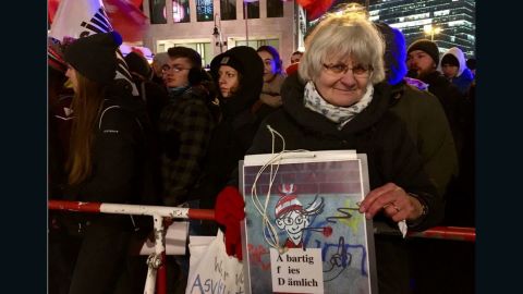 Irmela Schramm, 70, was demonstrating on the pro-refugee side. She has traveled around Germany for years, painting over neo-Nazi graffiti with heart shapes.