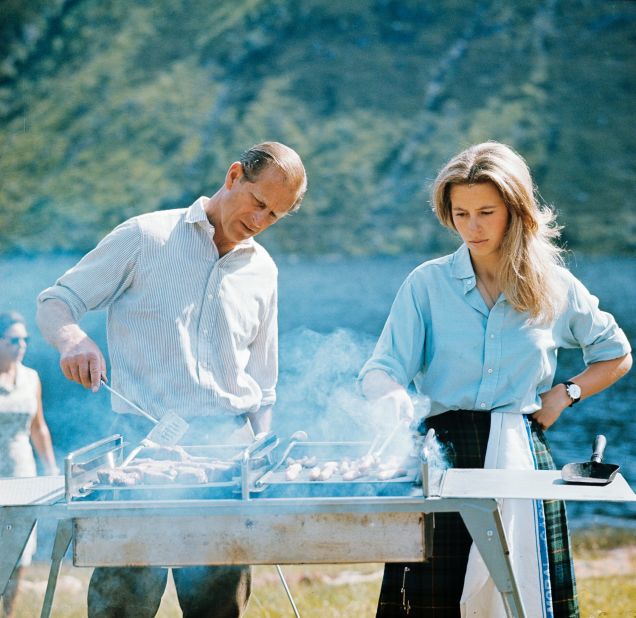 Prince Philip and his daughter, Princess Anne, prepare a barbecue on the Balmoral Castle estate in August 1972.