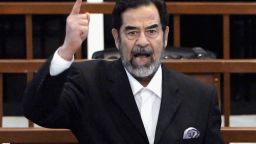 Former Iraqi President Saddam Hussein shouts as he receives his guilty verdict during his trial in the fortified 'green zone', on November 5, 2006 in Baghdad, Iraq.