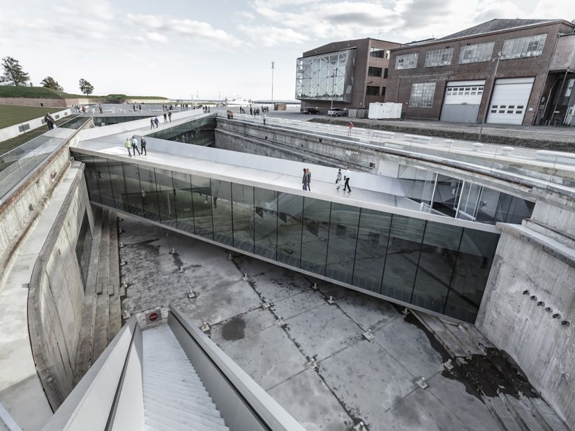 The sloping zig-zag bridges allow visitors to navigate within and around the dock, 23 ft (7 meters) below the ground.