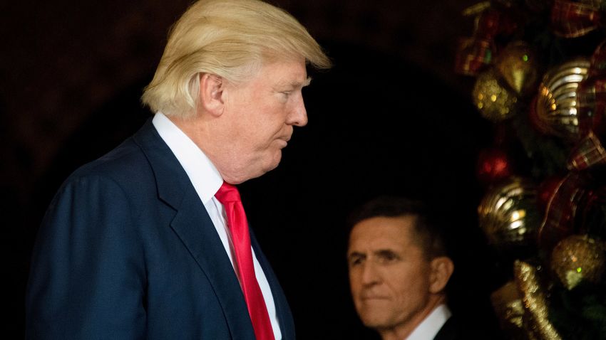 President-elect Donald Trump (L) stands with Trump National Security Adviser Lt. General Michael  Flynn (R) at Mar-a-Lago in Palm Beach, Florida, where he is holding meetings on December 21, 2016.