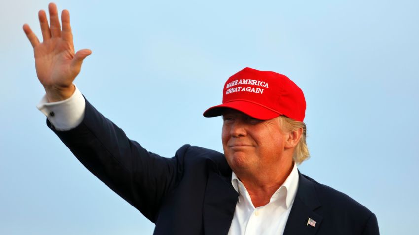 San Pedro, CA, September 15, 2015, Donald Trump, 2016 Republican Presidential Candidate, Waves During A Rally Aboard The Battleship USS Iowa In San Pedro, Los Angeles, California While Wearing A Red Baseball Hat That Says Campaign Slogan 'Make America Great Again.'. (Photo by: Visions of America/UIG via Getty Images)