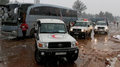 Snowfall has slowed convoys evacuating people from eastern Aleppo.