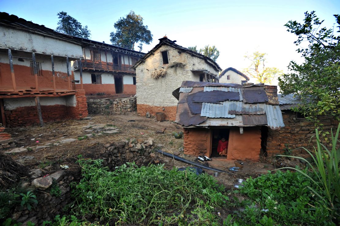 Sarswati Biswokarma, 13, sits inside a "Chhaupadi house" in the village of Achham.  