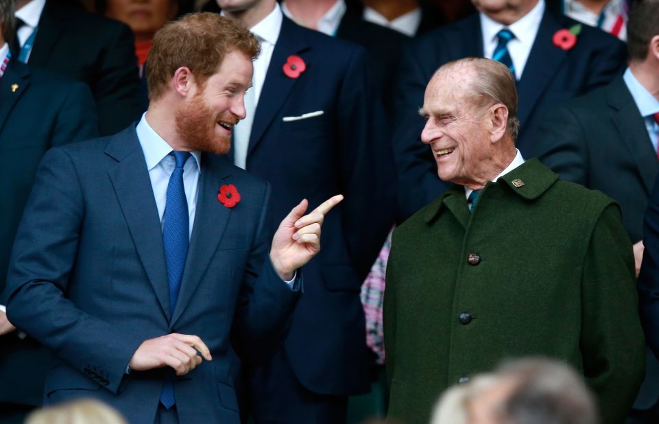 Prince Phillip and his grandson Prince Harry attend the Rugby World Cup final in October 2015.