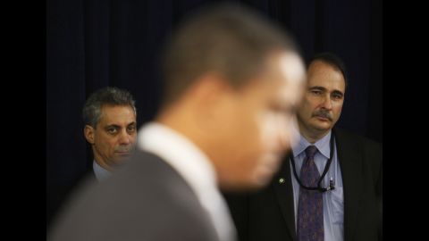 Axelrod and White House Chief of Staff designate Rahm Emanuel listen to Obama speak at a news conference in Chicago in December 2008. 