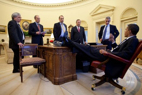 Obama speaks with aides in the White House Oval Office in February 2009. From left are Senior Advisor Pete Rouse, White House Director of Legislative Affairs Phil Schiliro, Axelrod, National Economic Council Director Lawrence Summers and Emanuel.