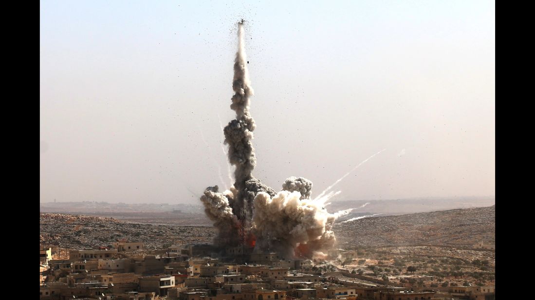 Smoke rises after a bomb explodes in a residential area in the Darat Izza neighborhood of Aleppo on October 4, 2016.